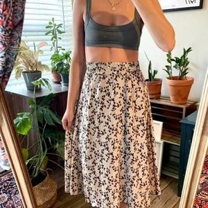 Earth toned floral vintage midi skirt size S.